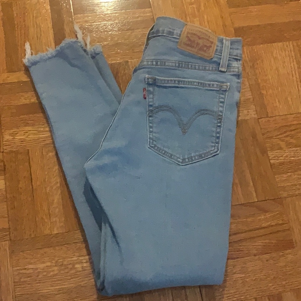 Levi’s Wedgie Skinny Light Wash with Distressed Rips and button fly Size 27